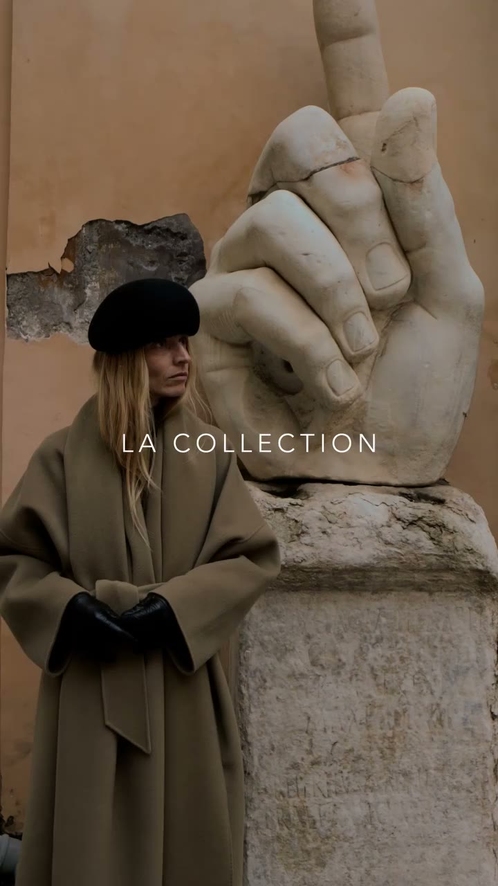 Viviane wears Tuba coat with Julie scarf, belted as one. Both crafted from a…
