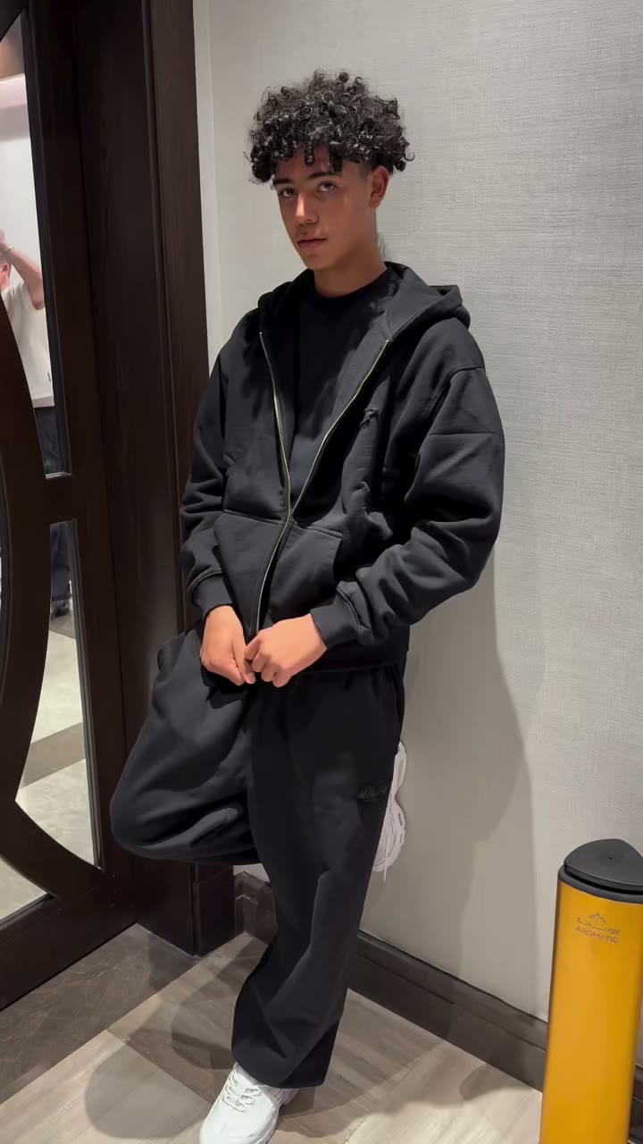 Cris Jr in our black basic tracksuit dropping on 12.04