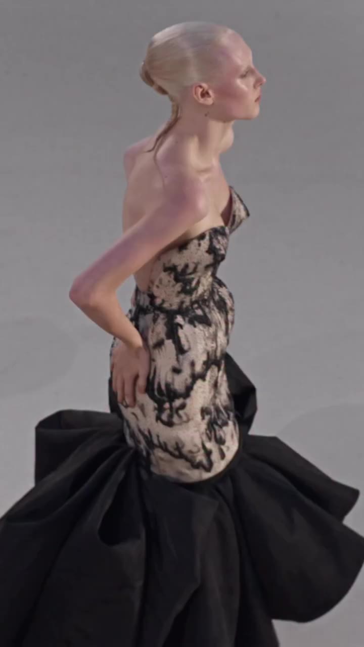 A couture silhouette centred around a bustier densely embroidered with…