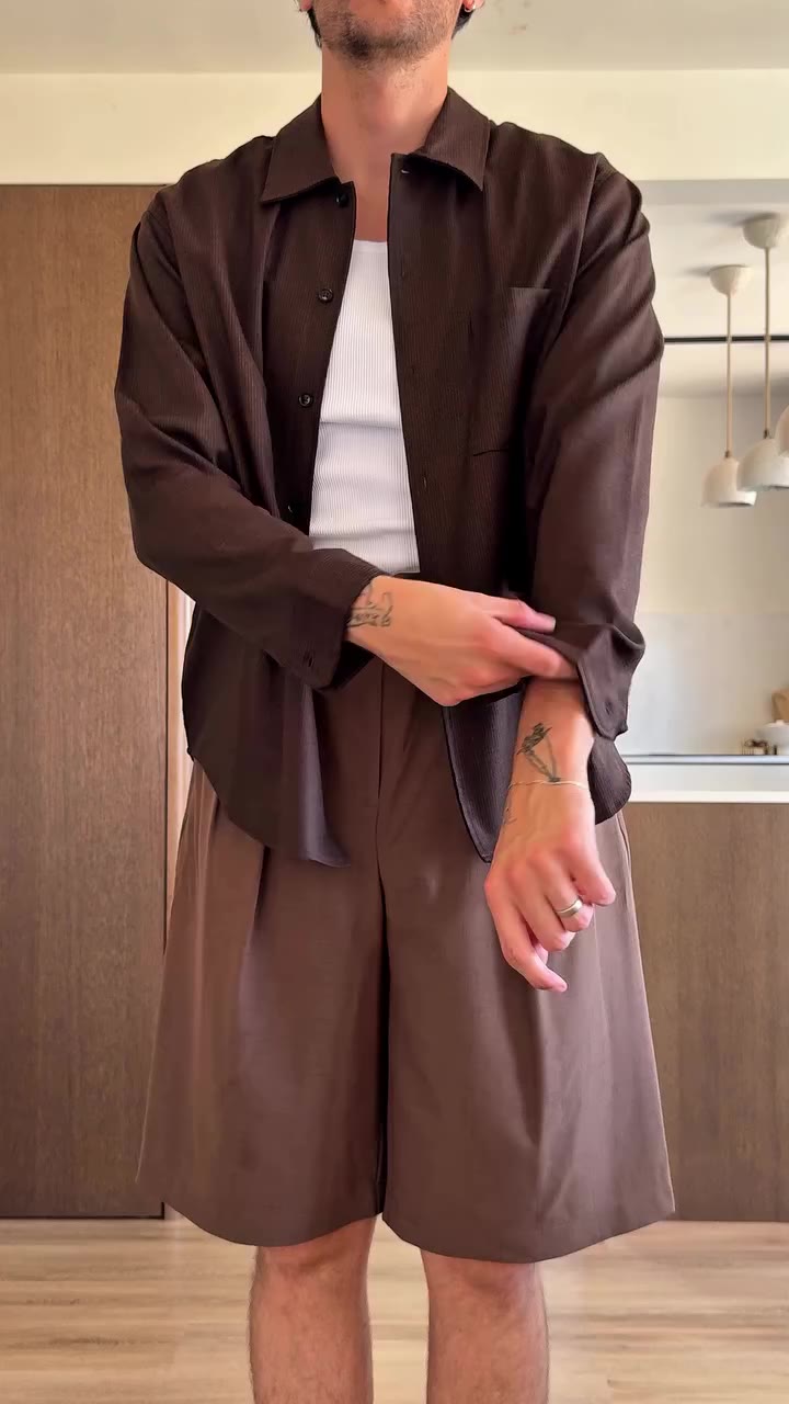 easy tonal late summer outfit, wide fit bermuda shorts with a brown loose…