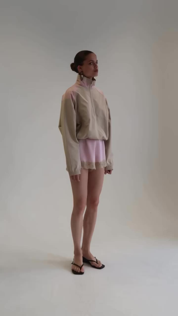 Sporty yet chic. Meet the Kael Funnel Neck Windbreaker paired with the Delle…