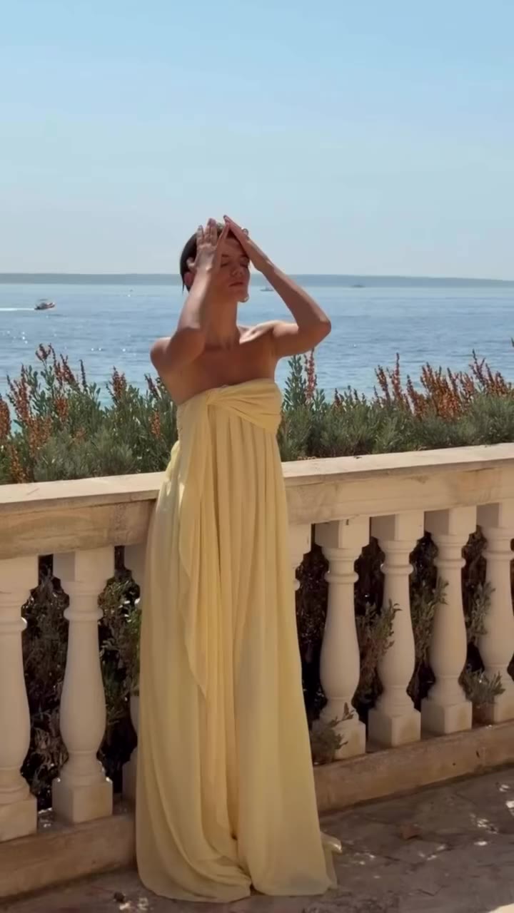 ELIANA DRESS A strapless maxi dress cut from lightweight chiffon. Designed…