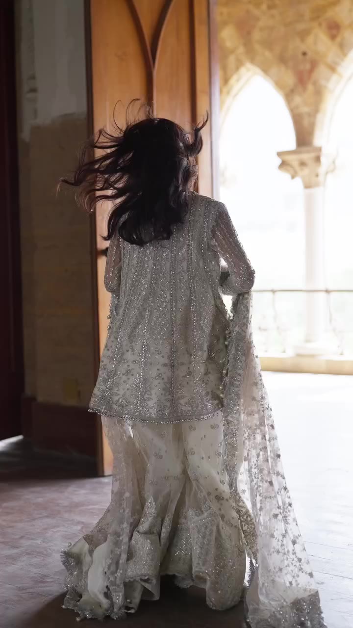 Afsun A sophisticated white ensemble that embodies timeless elegance with…
