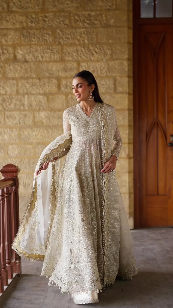 Hikayat A timeless off white ensemble featuring intricate tonal embroidery…