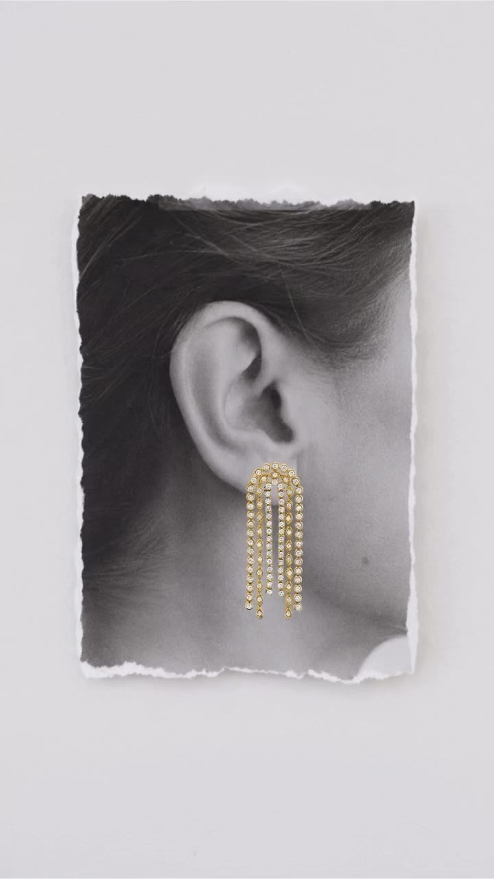 Earrings in motion. 14k gold and diamonds bring a fluid elegance to every…