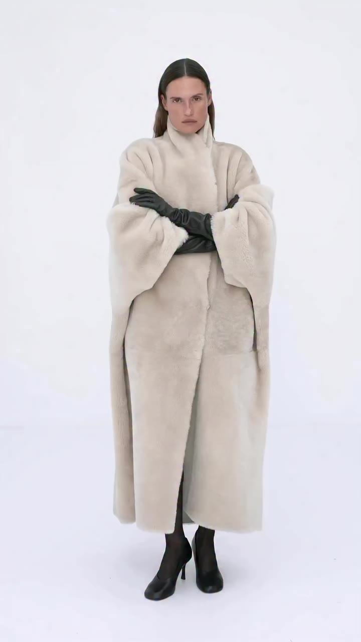 The Sculpted Shearling Coat in cream Available for pre-order in limited…