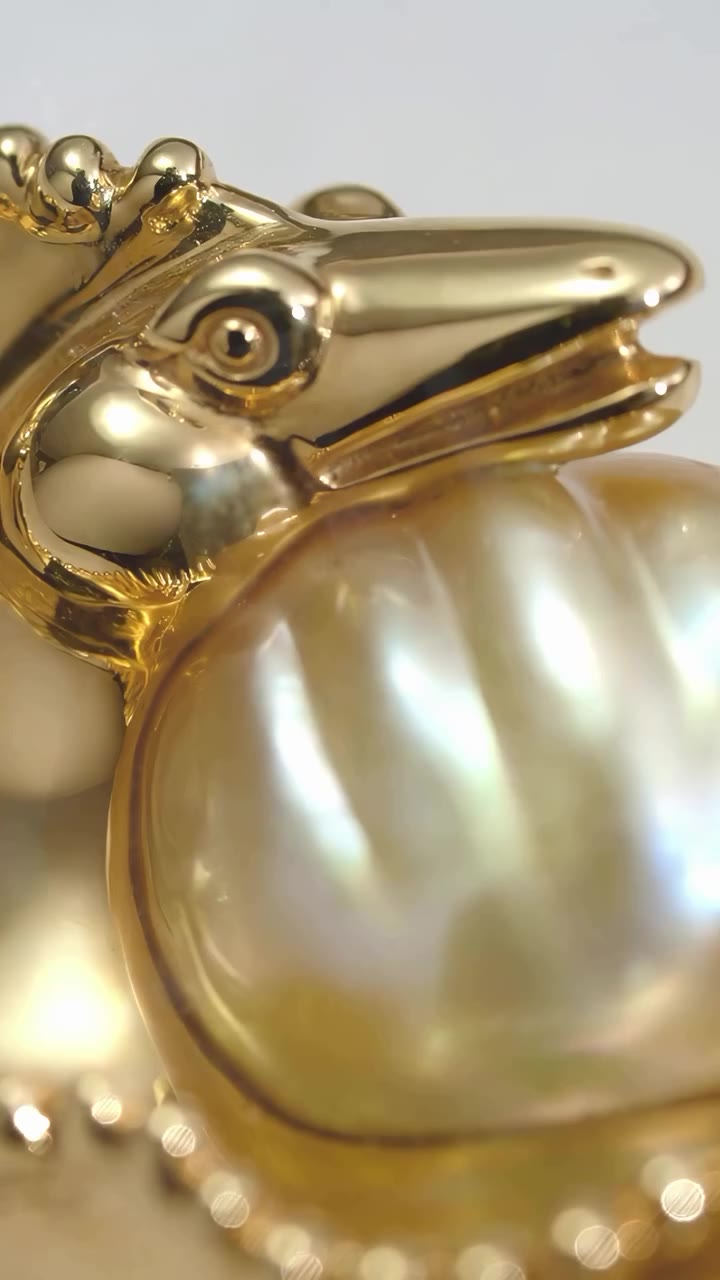 Revel in the La Mer en Majesté Gloups, La Murène pendant brooch, a captivating…