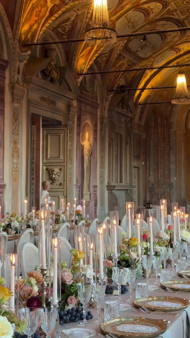 A romantic floral setting in the frescoed halls of Villa Corsini, surrounded…