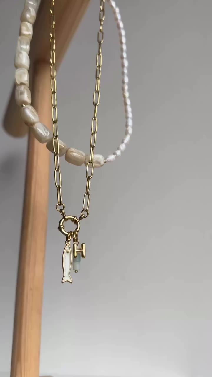 the fish & a baby bubble initial. pair her with with a pearl charm for my all…