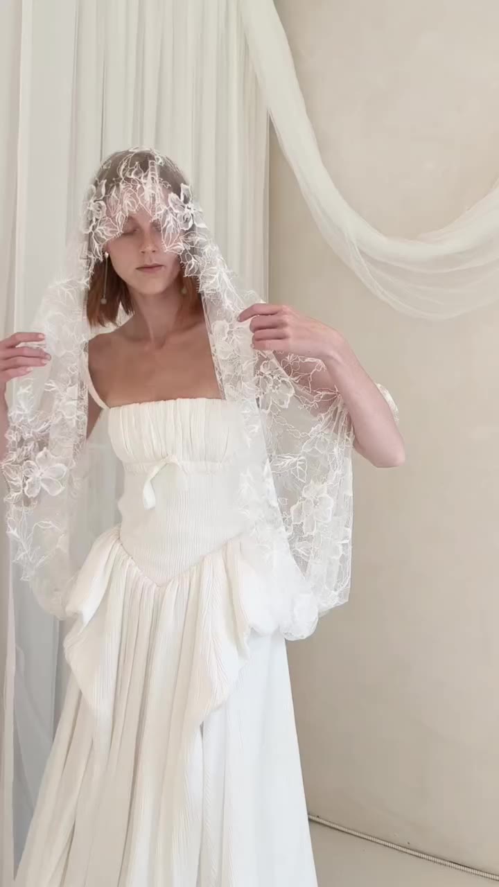 Aurelia, beneath a veil of lace. Romance, reimagined. #OUMA #BridalCouture…