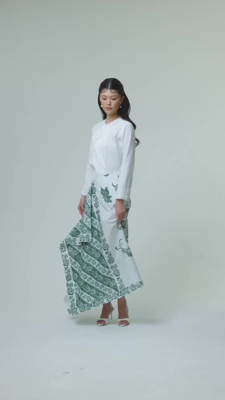 In Her Element. Hapsari Kain in Green, catching every beat with effortless…
