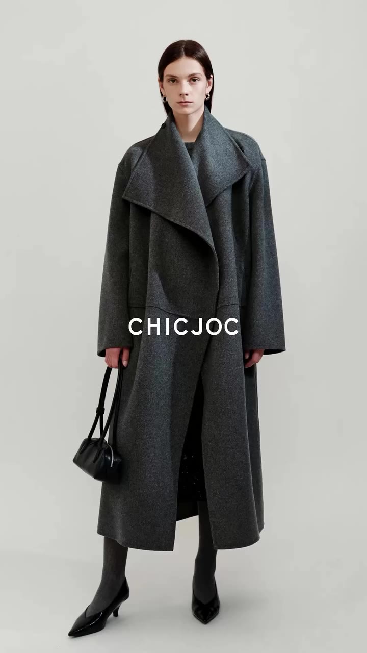Wide lapel anchors structured wool outerwear, soft tactile finish for…