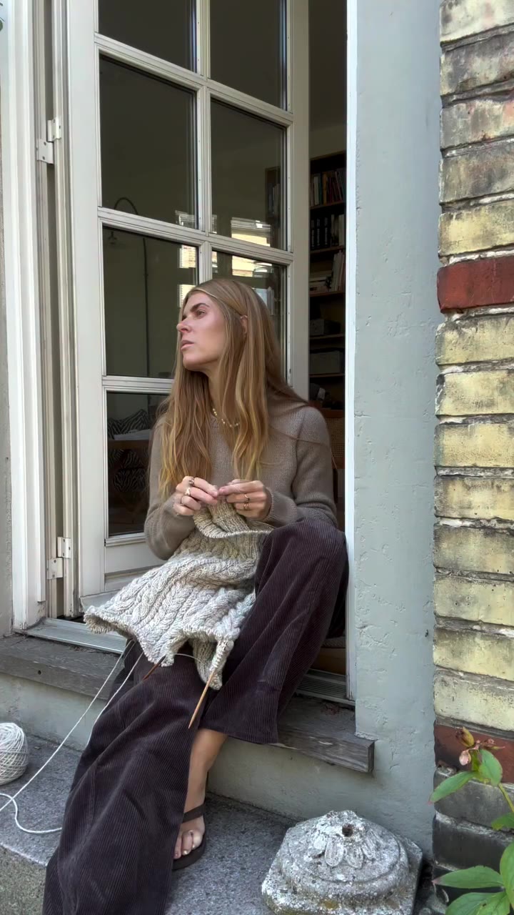 knitting and neighbourhood watching on a morning in september. wearing blouse…