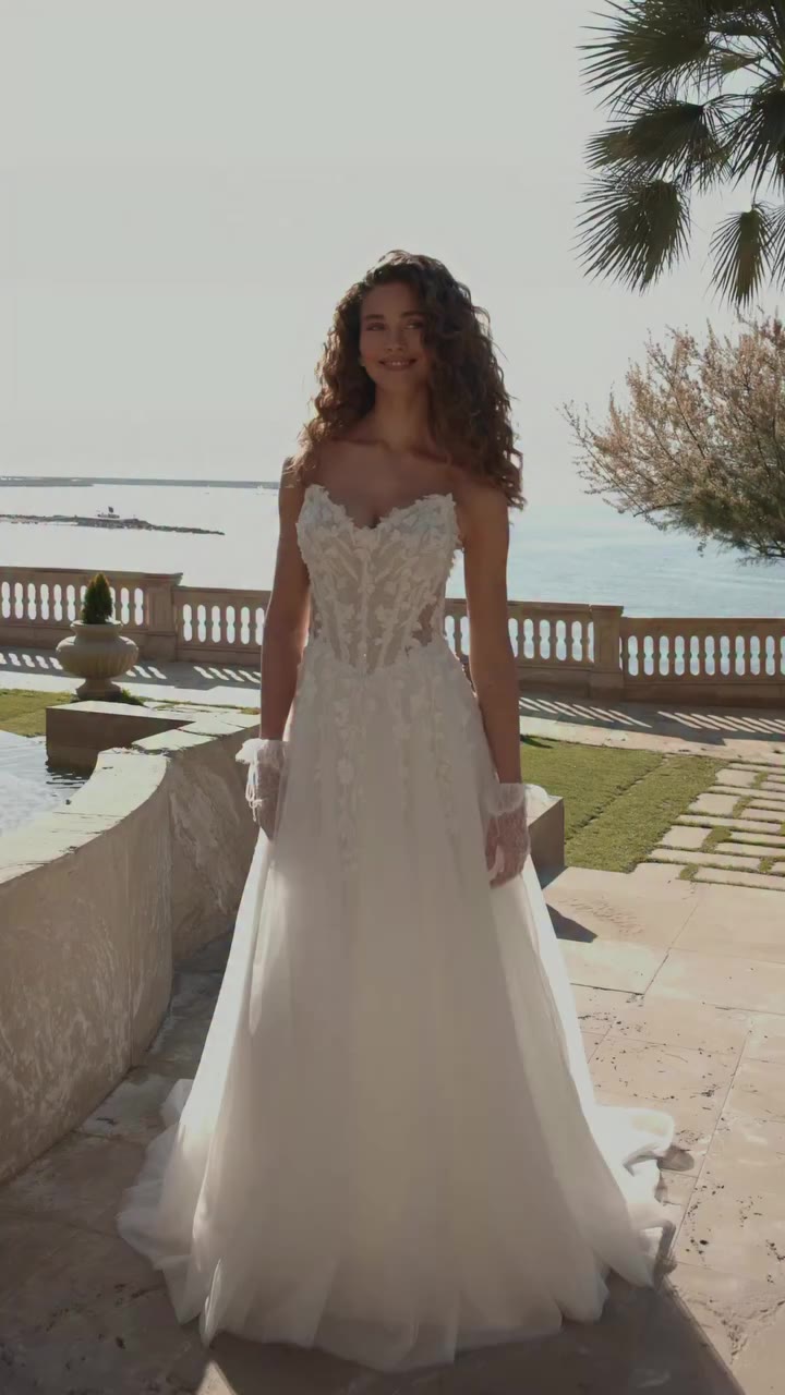 Soft romance, beautifully defined. A delicate A-line silhouette with floral…