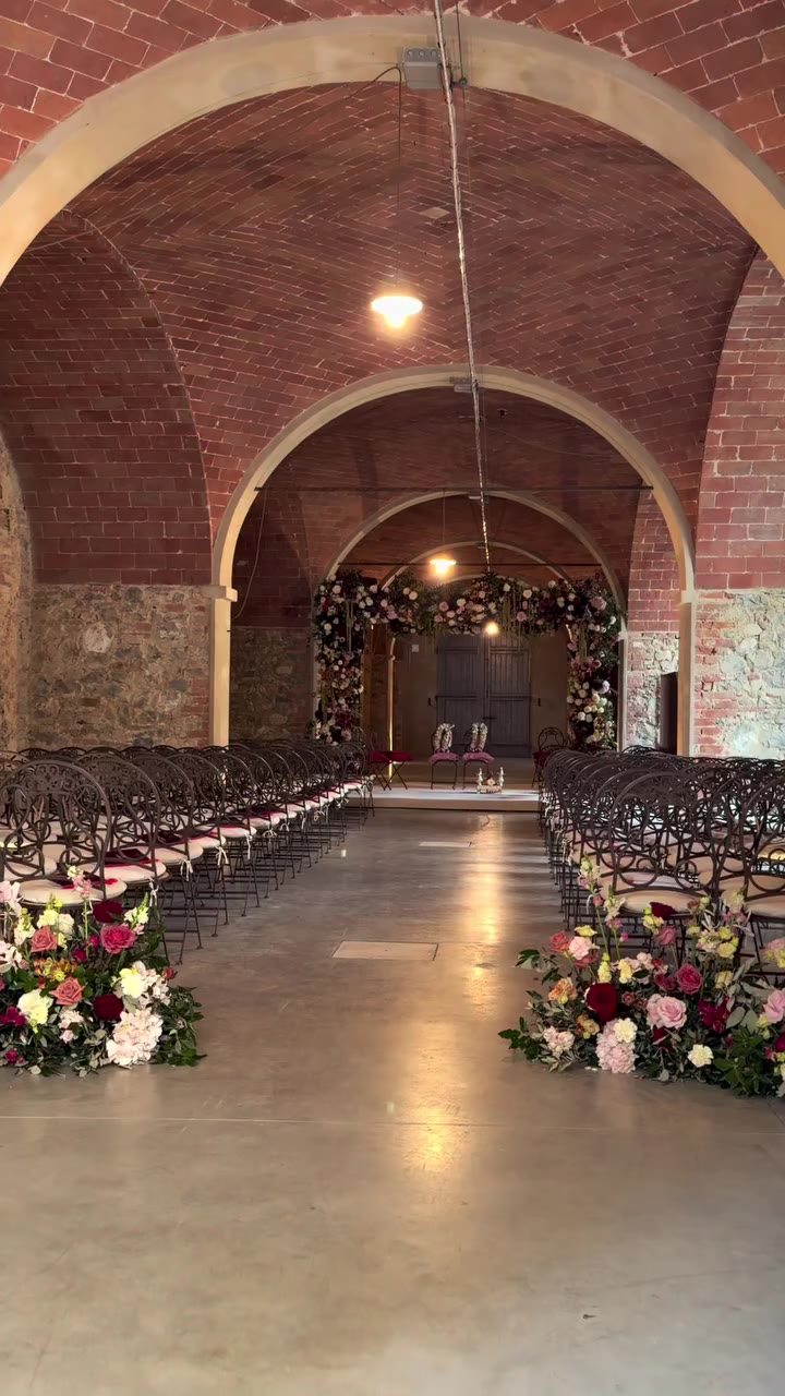 A vibrant celebration filled with colorful blooms, floral garlands and rich…