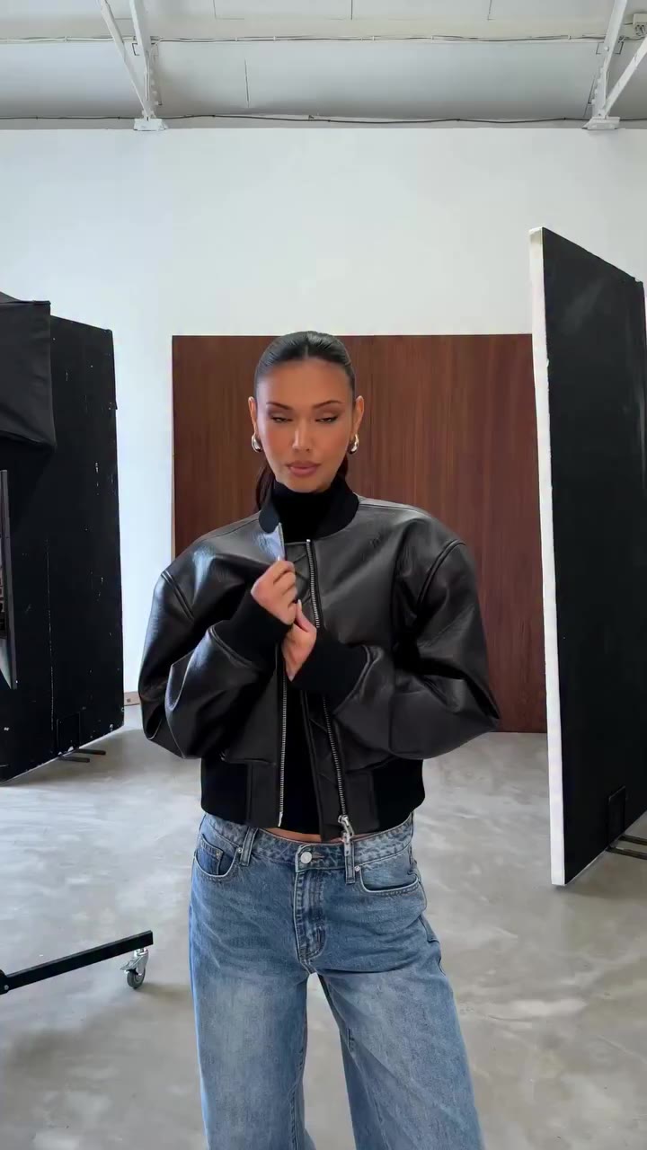 Structured shoulder pads paired with a sleek black finish. Shop the KYLIE…