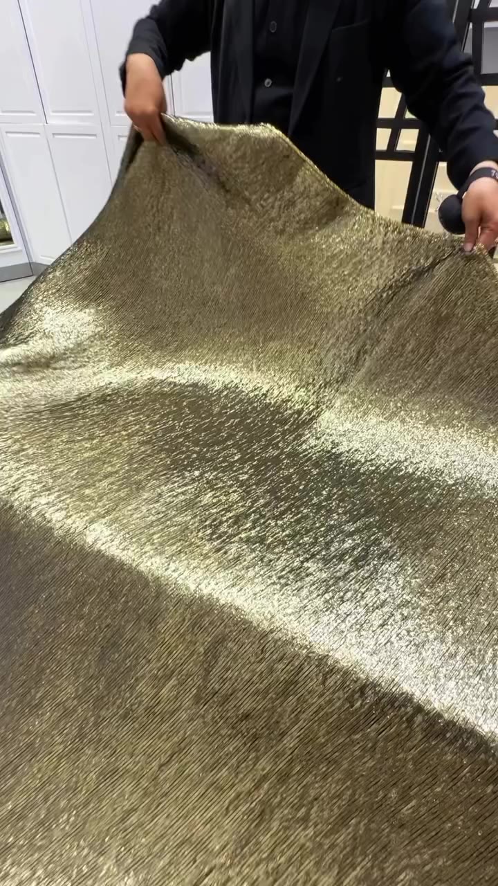 Linear-textured gold metallic fabric with a brilliant shimmer ✨ — High-Quality…