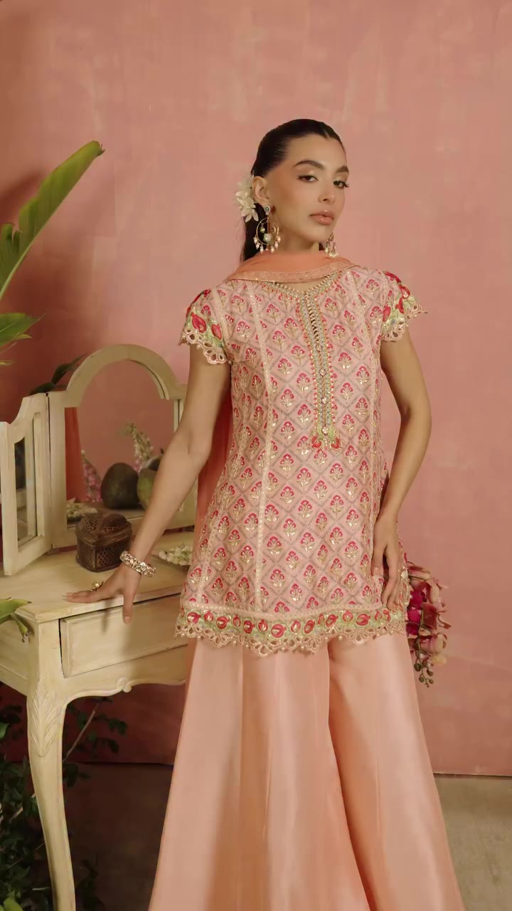 Soft hues meet intricate details in a silhouette made for celebrating. A…