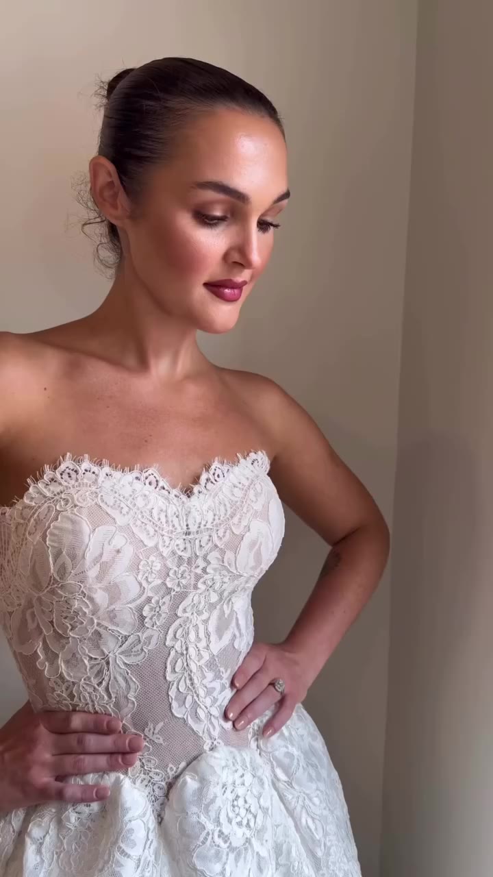 The dress of dreams: a full lace ball gown with sculpted godets and delicate…