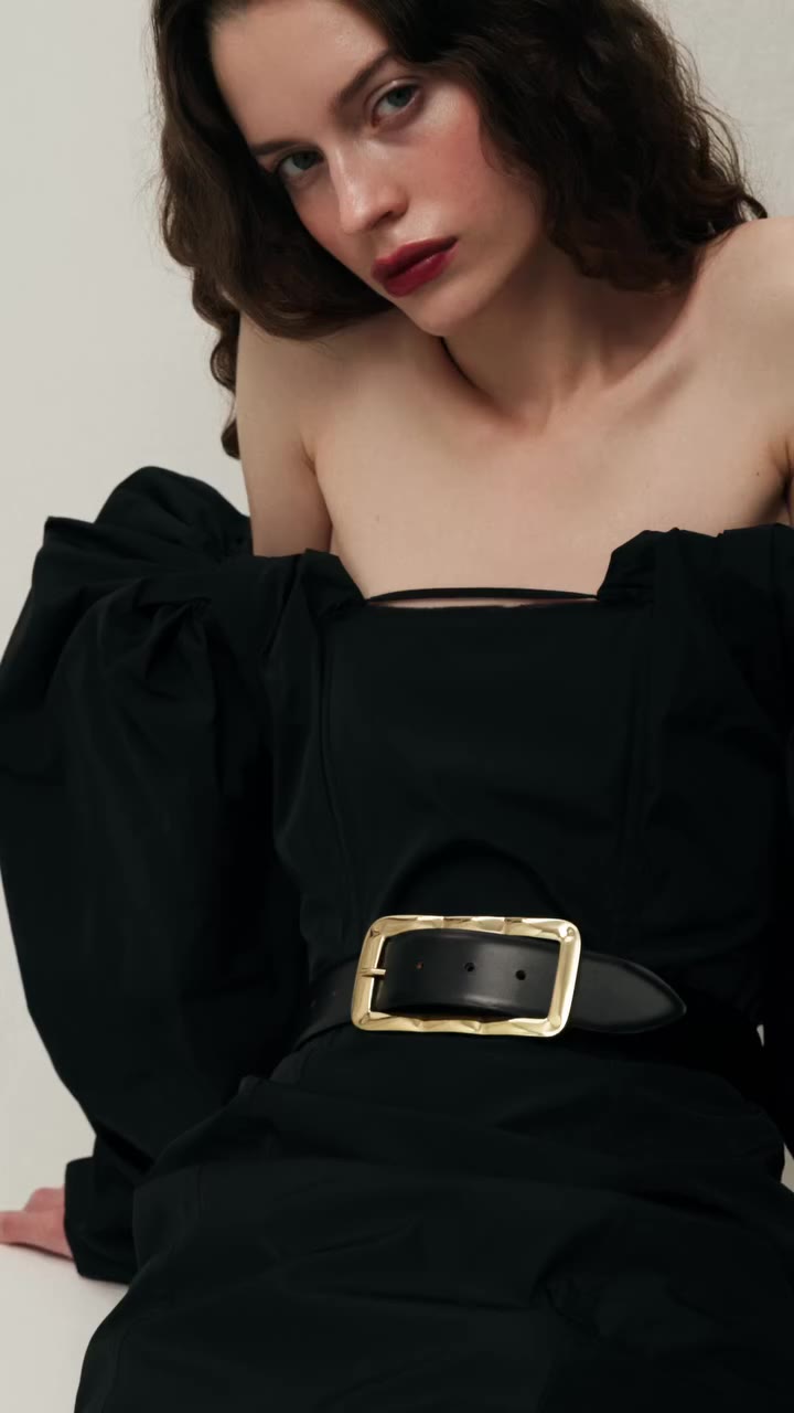 The Mila’s volume creates a strong line across the figure, balancing scale…