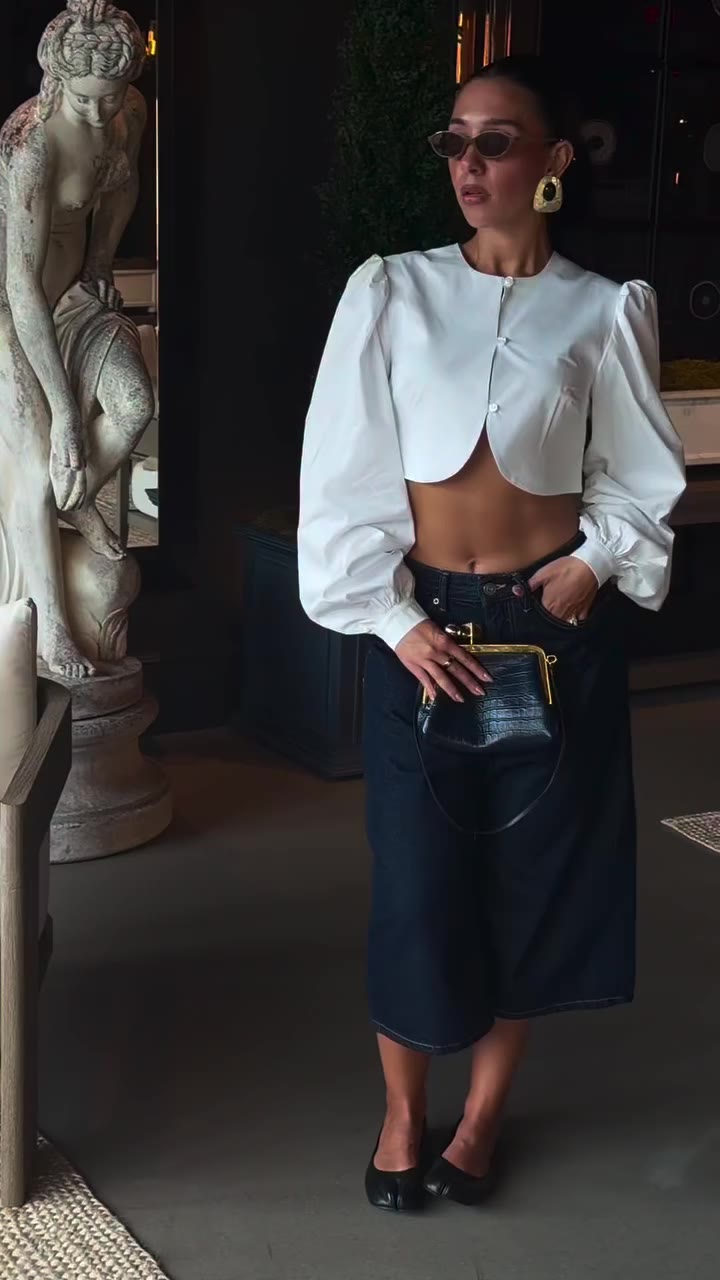The perfect transition into fall, the effortlessly structured Arc Blouse