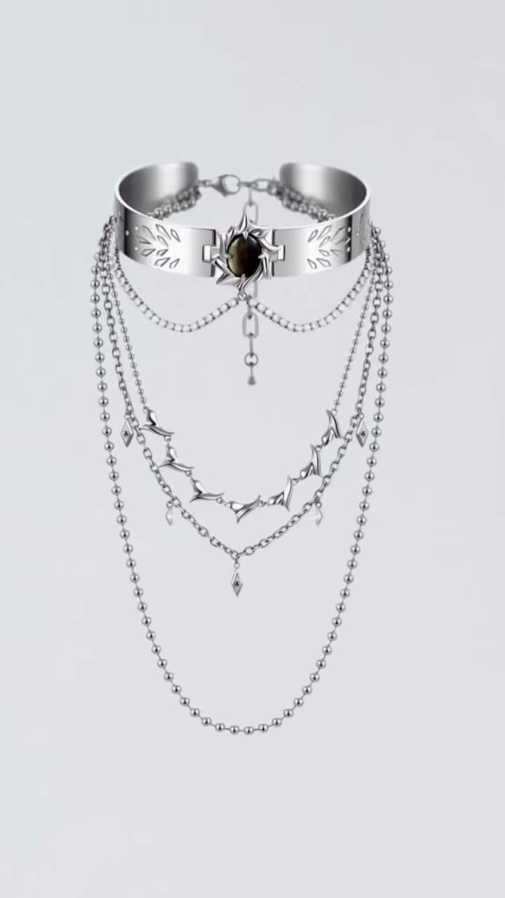 Draped in silver thorns. This multi-layer choker combines rigid metal collar &…
