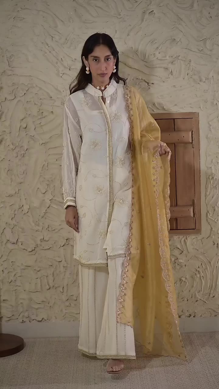 Soft ivory, touches of gold and an easy silhouette made for the festive…