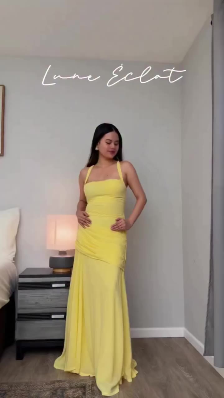 Bright yellow halter maxi dress 🌼 Soft ruched waist detail flows into a…