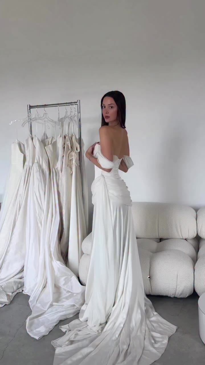 Paloma is romance with a little grandeur Luminous satin falls from a reverse…