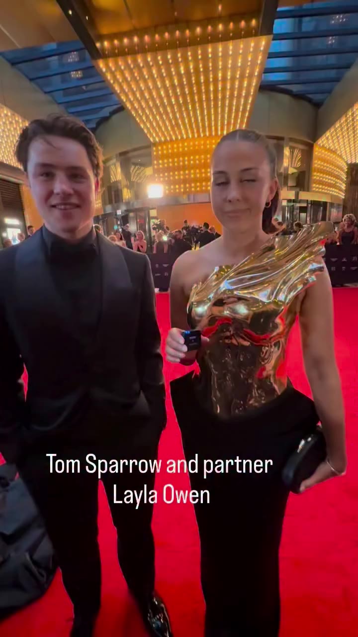 Melbourne Football Club’s Tom Sparrow and partner Layla Owen looking…