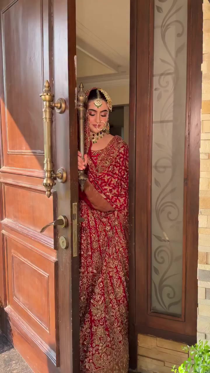 A bride in red, with the splendour of another era resting softly in the…