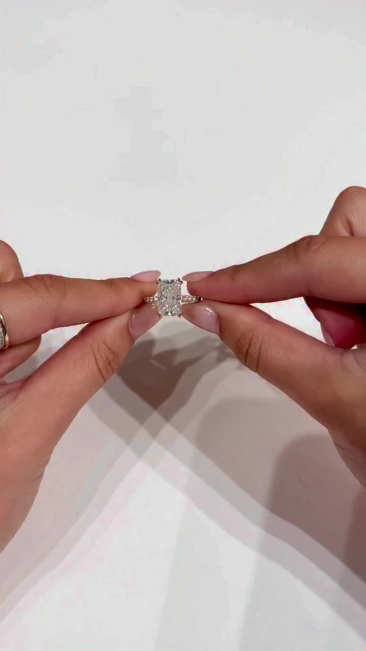 Our 2mm pavé portia setting with this elongated radiant cut and dainty double…