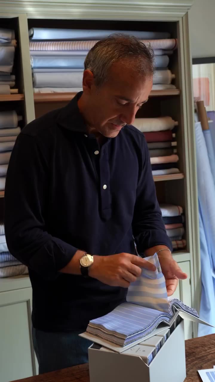 Luca is choosing the fabrics for the next shirts, one swatch at a time. Swatch…