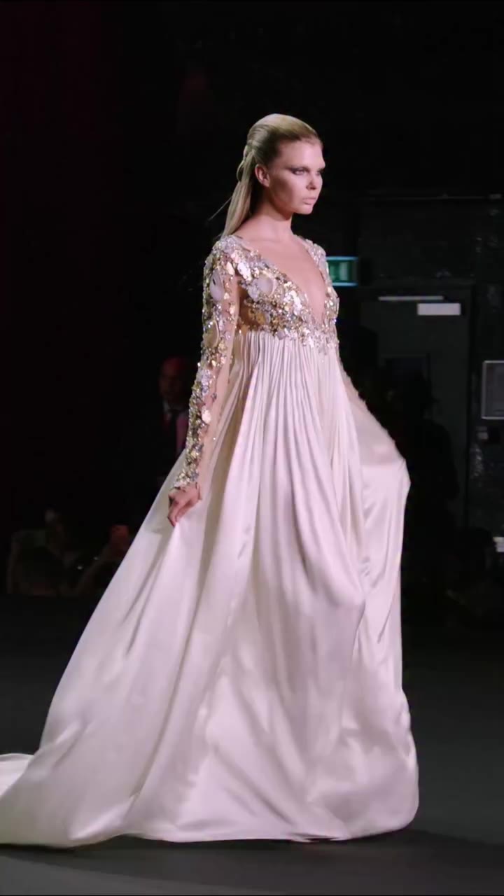 Long dress in pleated crêpe satin, embroidered with grey agate cabochons and…