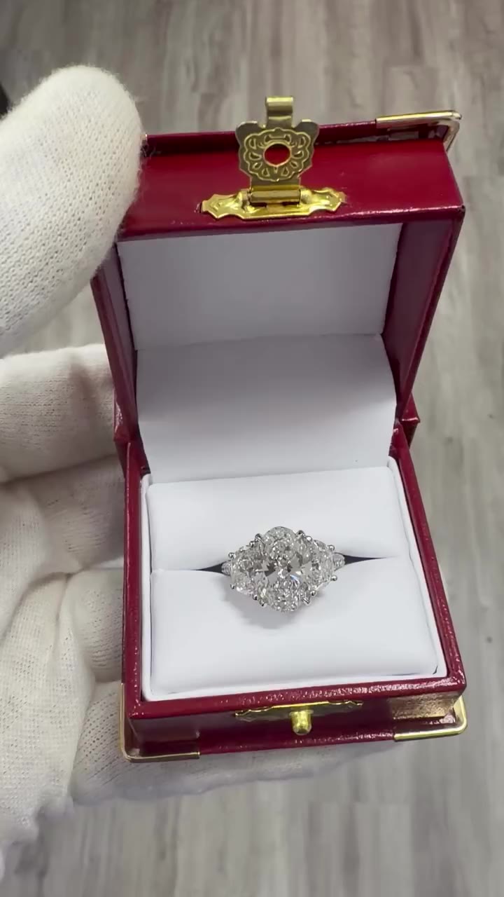 Would you say yes to this three stone oval diamond ring, with full pavè band?…