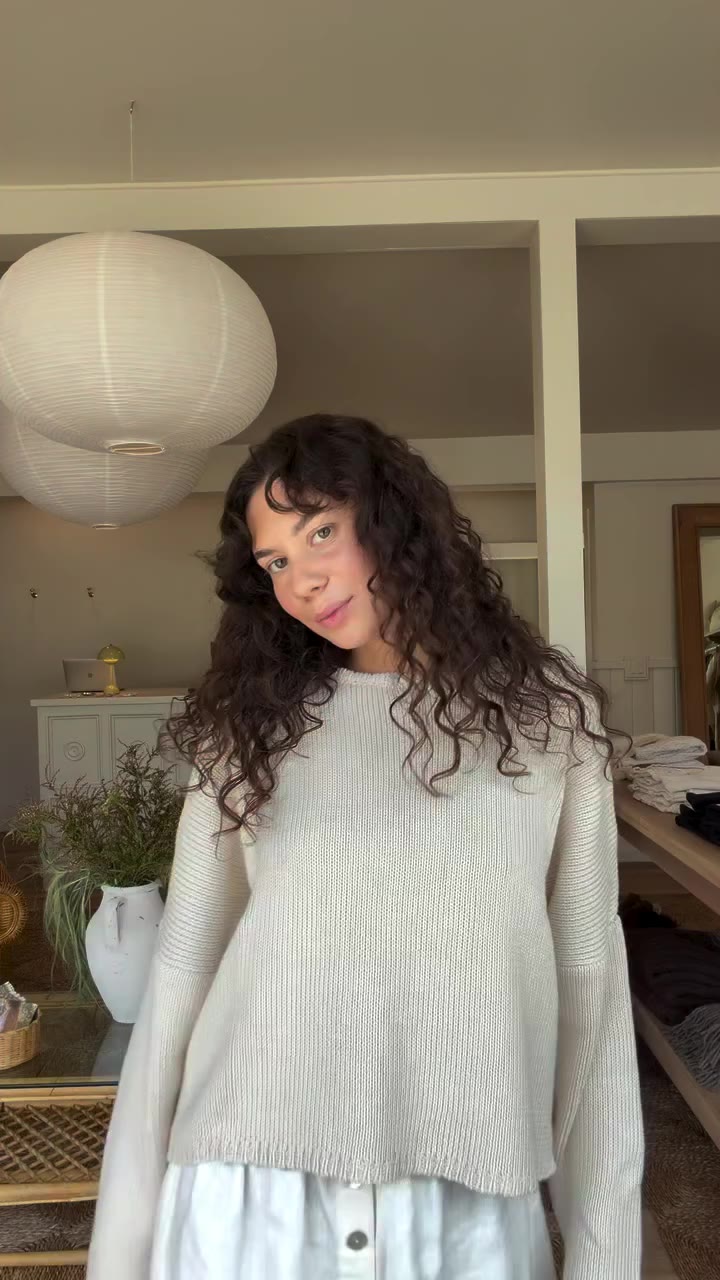 Cadance at the Laguna Beach Storefront trying on the new knits — all available…