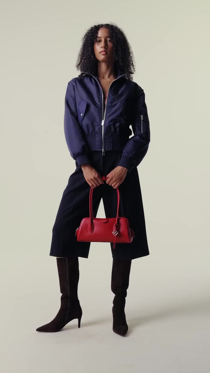 Midnight navy and refined tailoring set a polished tone, paired with sleek…