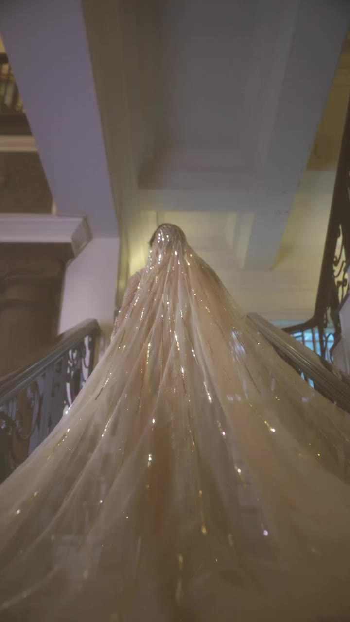 A masterpiece of modern festive glamour this ethereal net gown is adorned with…