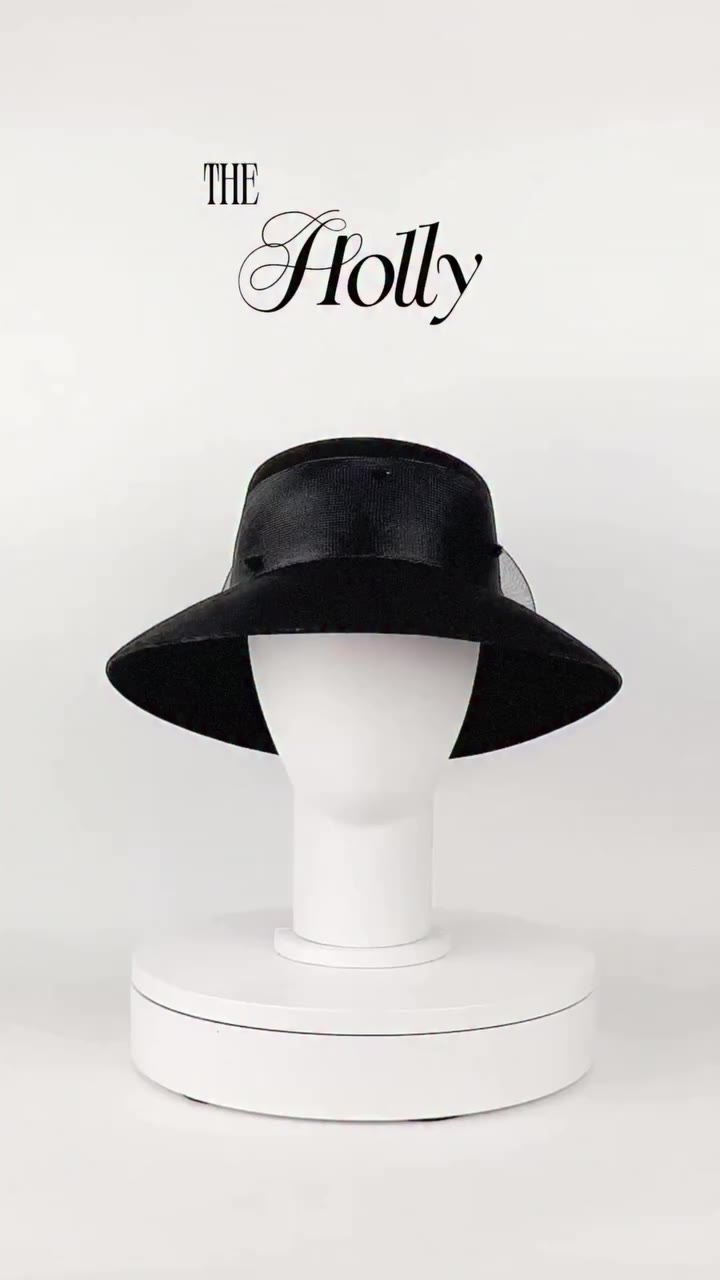 HOLLY hat in black. A sculptural silhouette with a distinctly retro attitude…