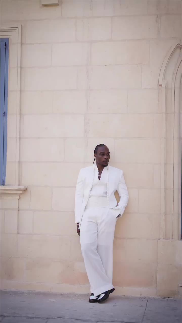 A white suit defined by intricate pearl detailing,waist wrap. Refined, and…