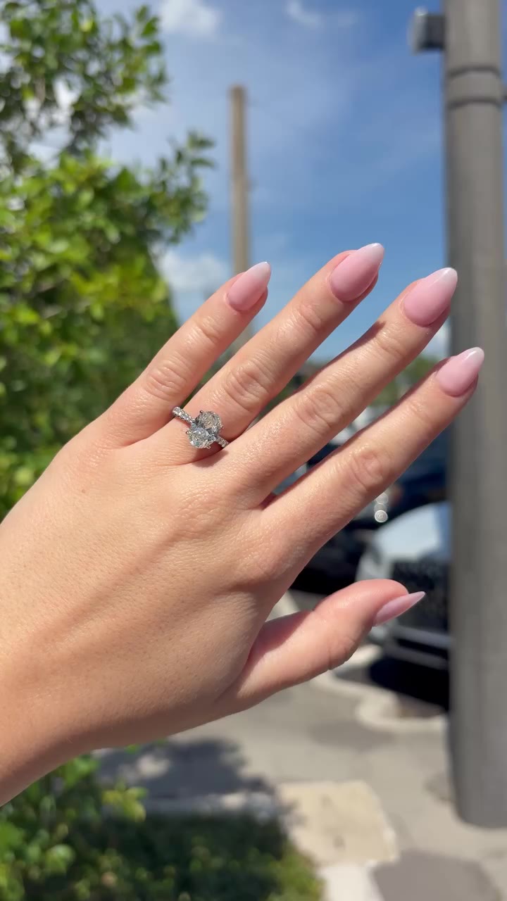 Your left hand called. It wants this. 📞💍 An oval diamond surrounded by a…