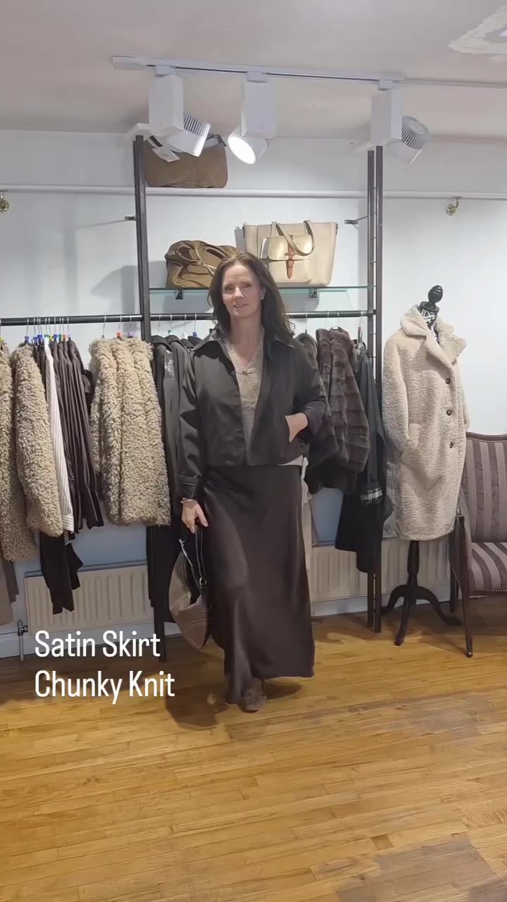 An every day look for a satin skirt Team with a chunky knit and pumps Elevate…