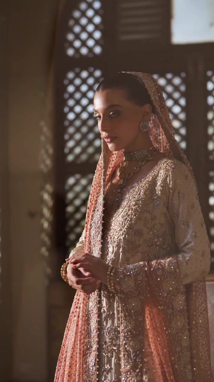 Noor A soft peach expression of timeless bridal luxury. Intricate gold and…