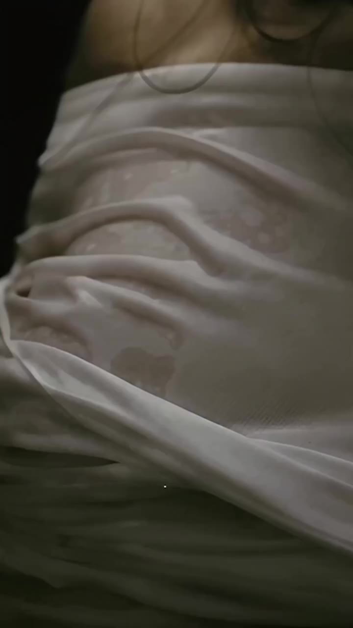 The wet fabric clings to the body, naturally following its curves and creating…