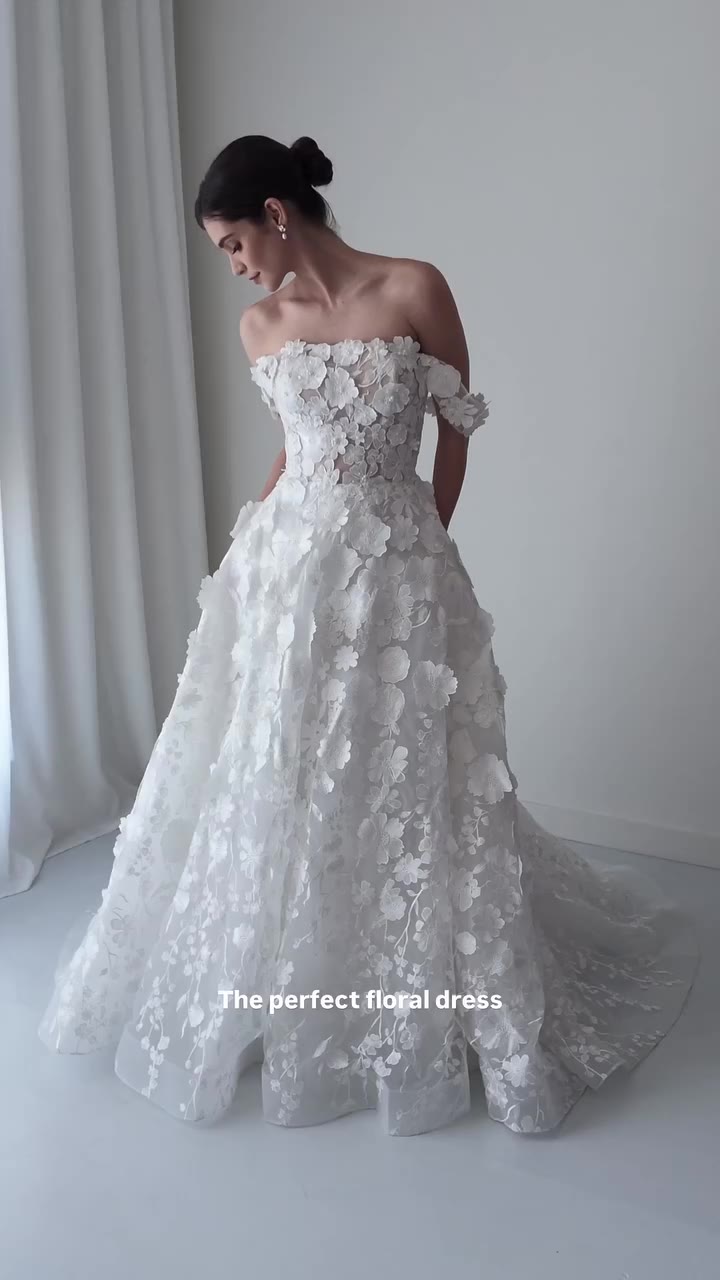 Floral, but make it unforgettable. Delicate 3D blooms, soft off-the-shoulder…