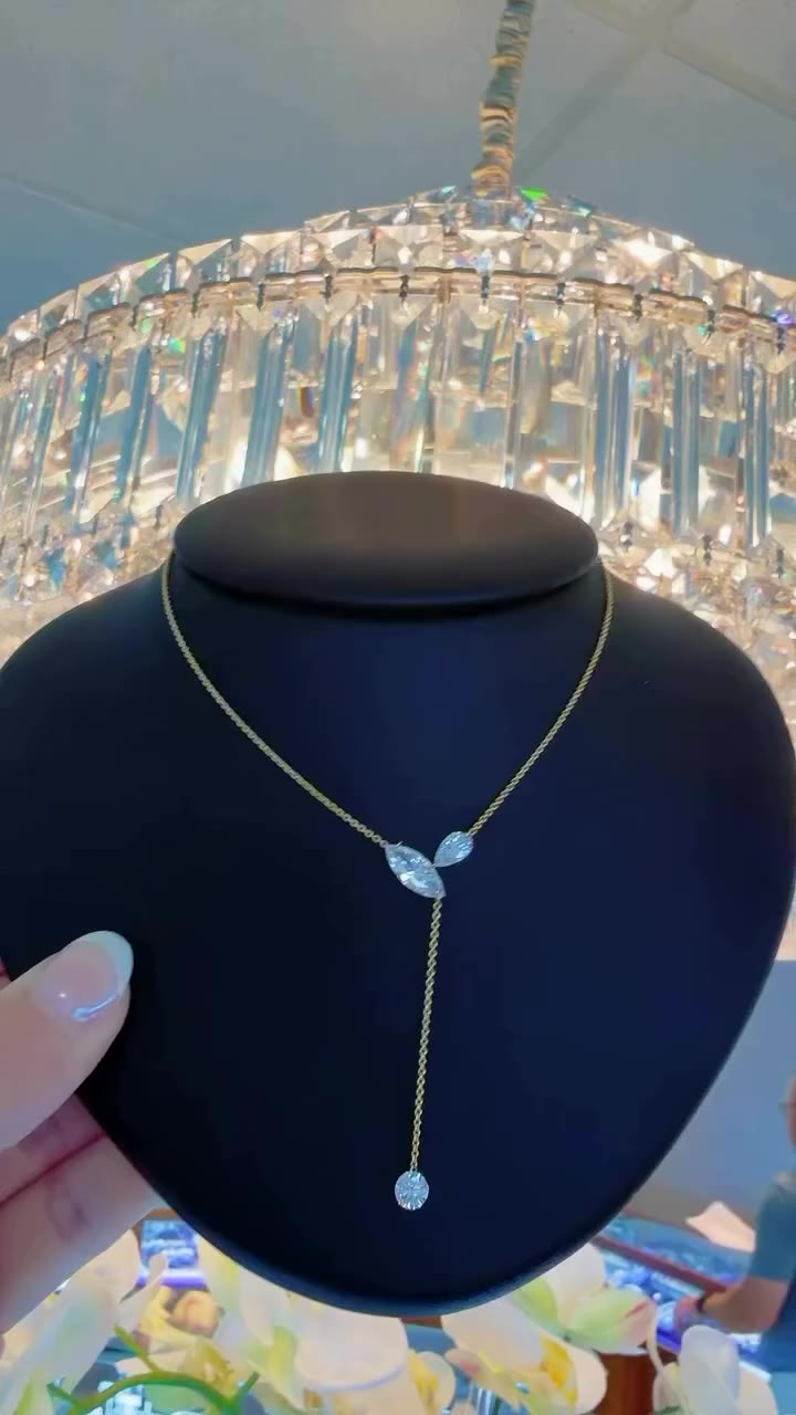 This stunning drop necklace brings ALL the sparkle with a delicate, elegant…