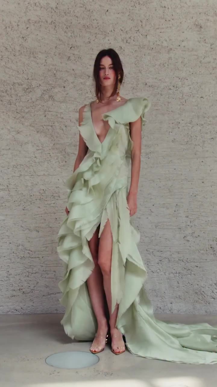 The making of the Bazzar Gown. Silk is frayed by hand, transforming delicate…