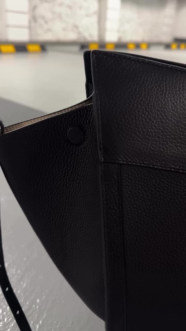 The Shopping grained leather bag. A refined silhouette, designed to elevate…
