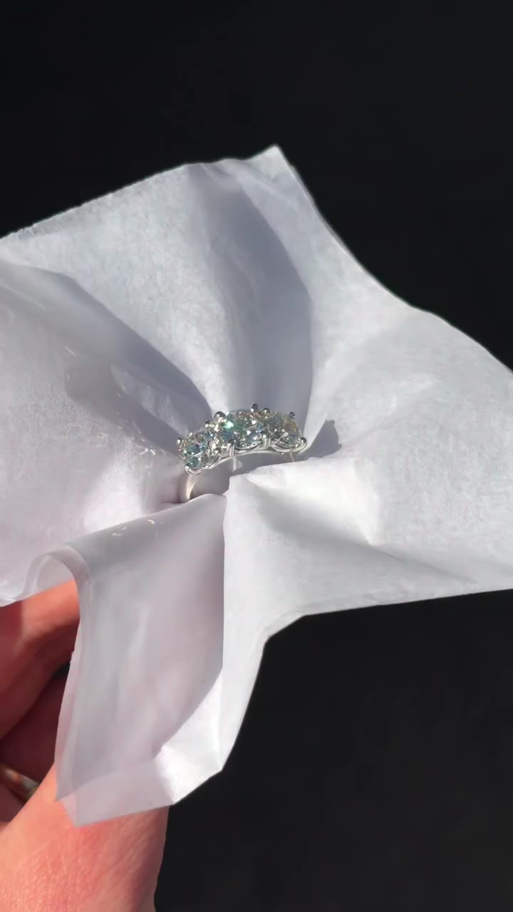 A platinum natural diamond trilogy engagement ring, made by our in-house team…