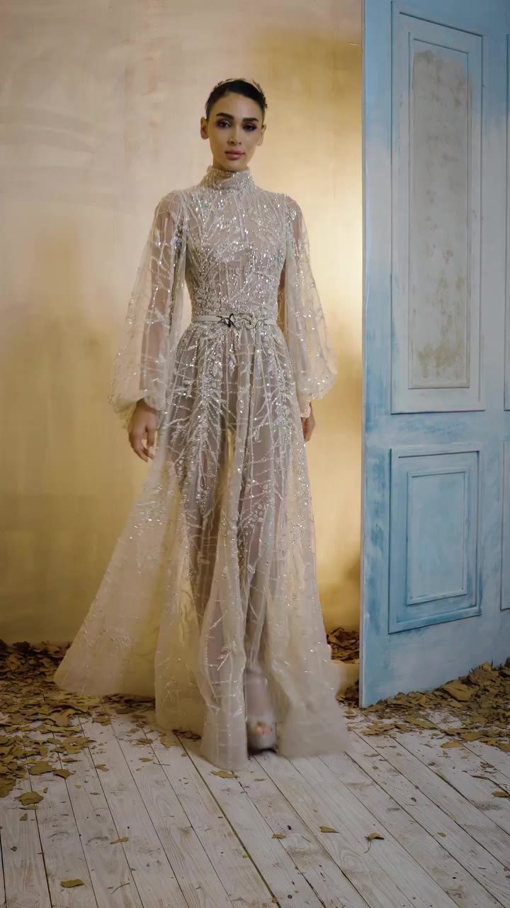 Where structured tailoring meets warm luminescence. #ZiadNakad #RTW #Aurea…